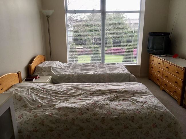 Bedroom featuring light carpet | Image 6