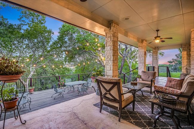 View of patio / terrace with outdoor dining space, a deck, ceiling fan, and an outdoor living space | Image 13