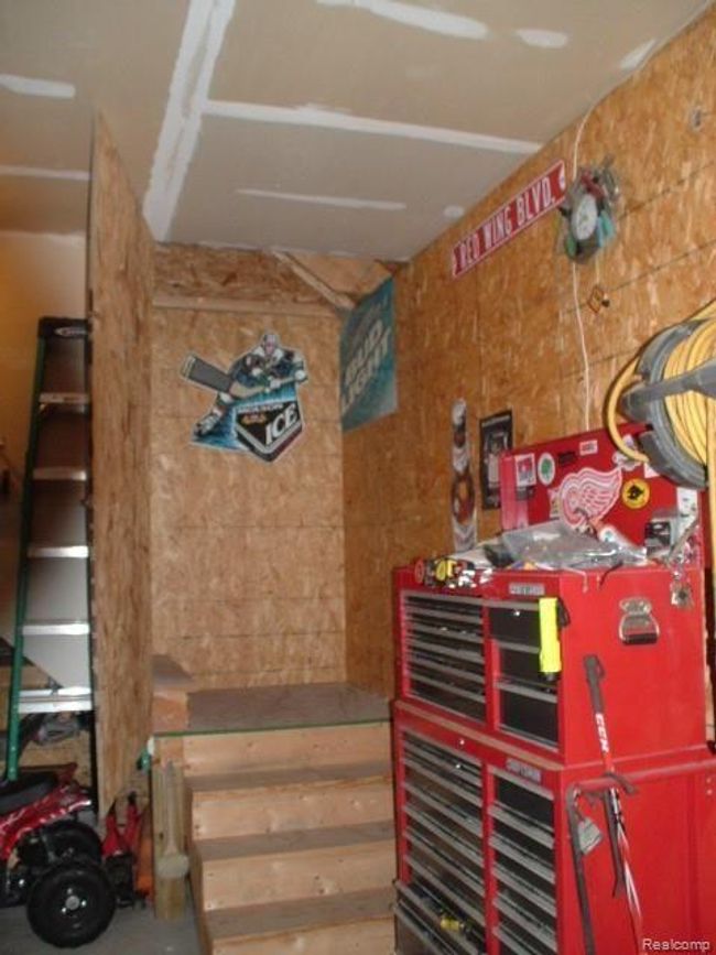 Full Sized Stairway In Garage To Storage Area | Image 40