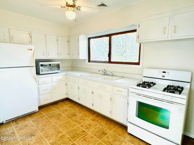 Well appointed eat-in kitchen. Perfect for little dinette table. Right off the side door and laundry | Image 13