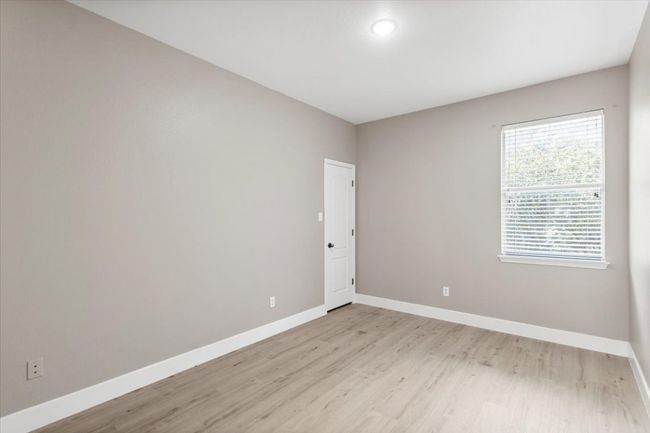 Empty room with baseboards and light wood-style floors | Image 20