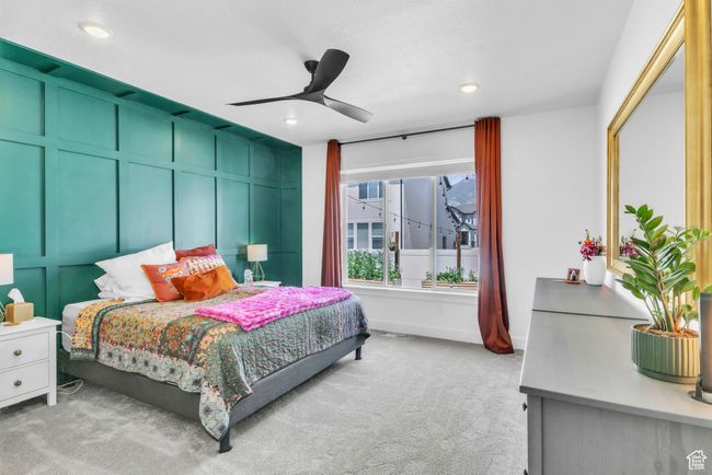 Bedroom with a decorative wall, light colored carpet, recessed lighting, and a ceiling fan | Image 17