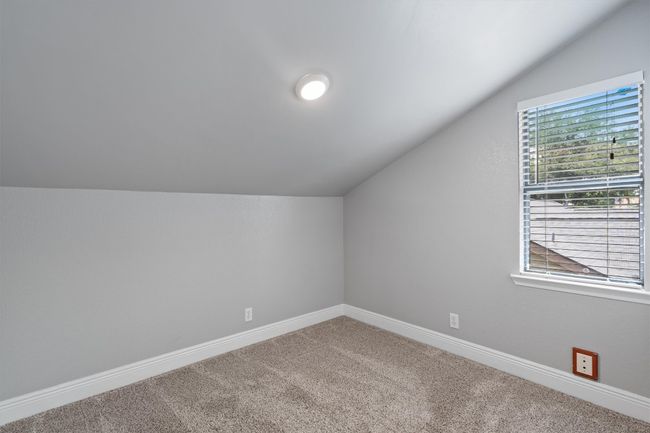 Bonus room featuring lofted ceiling and carpet | Image 27