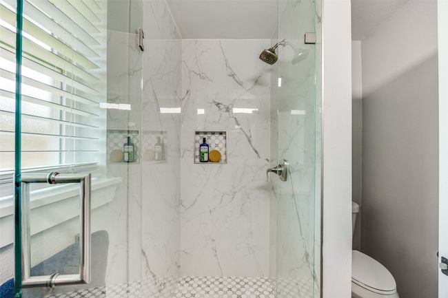 Full bathroom with a marble finish shower | Image 23