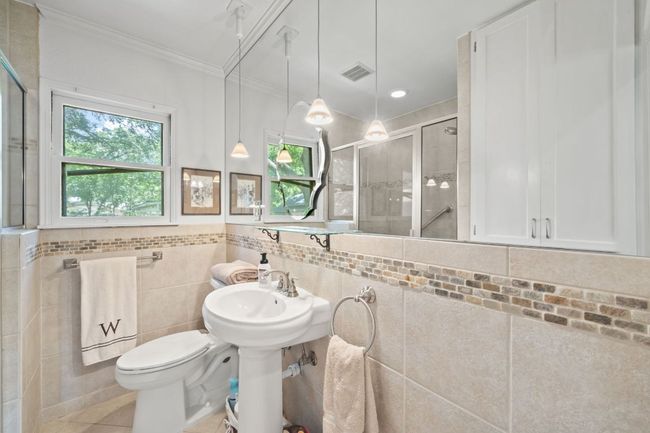 Full bathroom featuring crown molding and a stall shower | Image 8