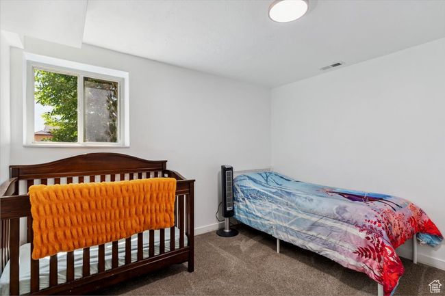 Bedroom with carpet and baseboards | Image 22
