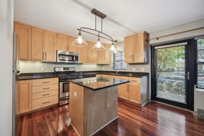 Nicely updated kitchen with granite counter tops and stainless steel appliances | Image 3