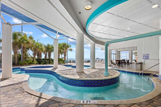 Pool featuring a community hot tub and a patio | Image 30