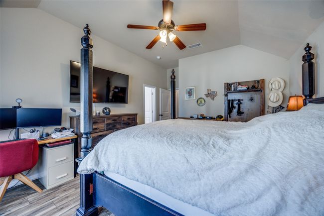 Bedroom with ceiling fan, lofted ceiling, and light hardwood / wood-style floors | Image 14