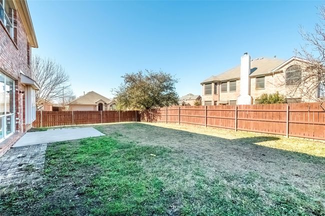 View of yard featuring a patio, a fenced backyard, and a residential view | Image 37