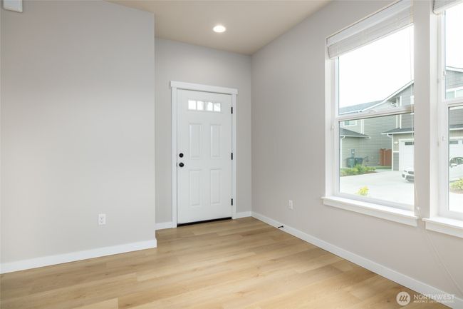 LVP flooring in the great room, kitchen and dining room. | Image 4