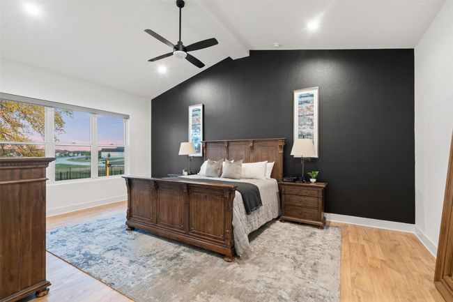 Primary Bedroom with Vaulted Ceilings and designer accent wall and private access to back pool deck. | Image 20