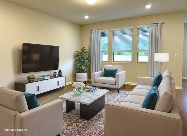Living room with LVP floors, baseboards, and recessed lighting | Image 6