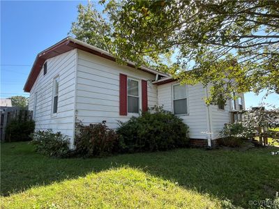 View of property exterior with a yard | Image 3