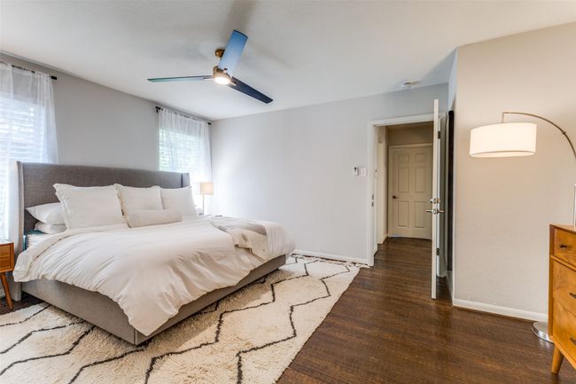 Bedroom featuring wood finished floors and ceiling fan | Image 17