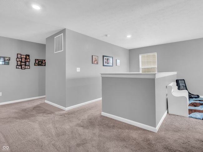 interior space with recessed lighting, visible vents, carpet, and baseboards | Image 22