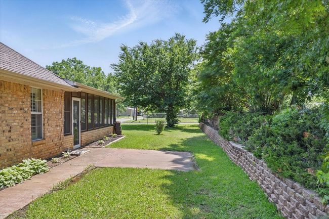 View of yard with a patio and a sunroom | Image 26