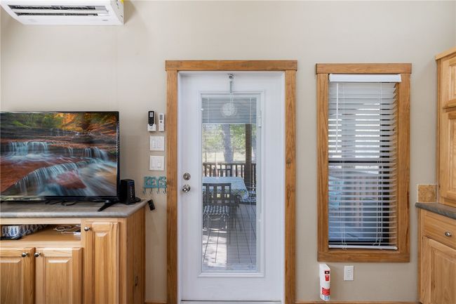 Entryway featuring a wall unit AC | Image 7