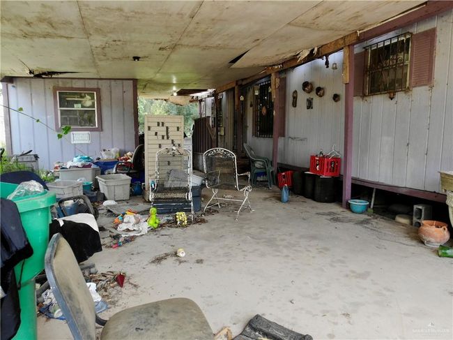 Miscellaneous room with unfinished concrete floors | Image 12