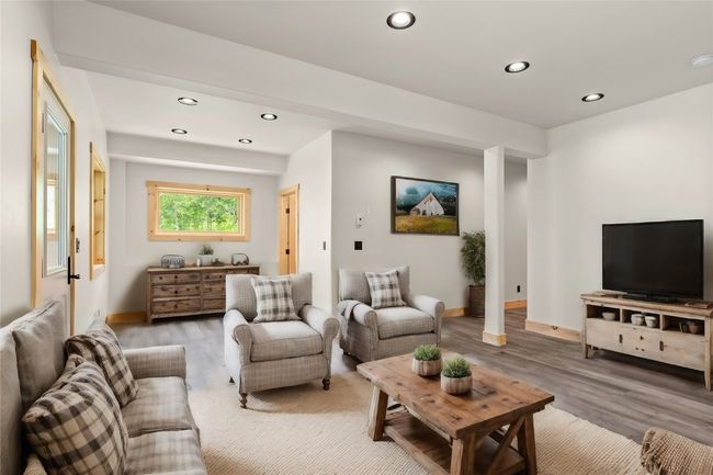 Virtual staged downstairs as Living space | Image 39
