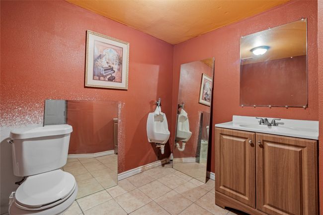 Bathroom featuring tile patterned floors, toilet, and vanity | Image 22