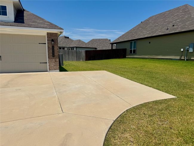 Extended driveway and 2-car garage with keypad entry for added convenience. | Image 23