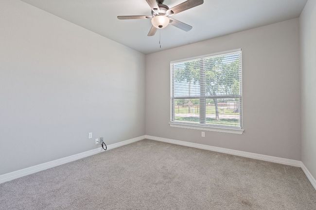 Spare room featuring carpet and a ceiling fan | Image 28