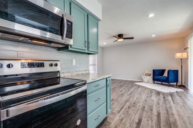 New stainless steel appliances, painted cabinetry with new hardware and granite! | Image 4