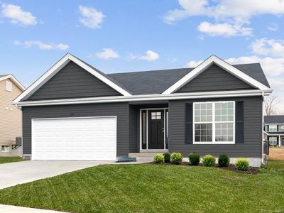 View of front facade with a front lawn and a garage | Image 1