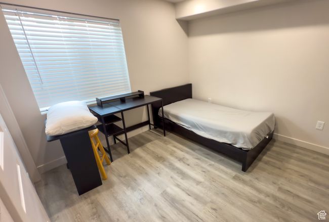 Bedroom featuring light wood-style floors | Image 21