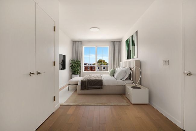 Bedroom with baseboards and wood finished floors | Image 8