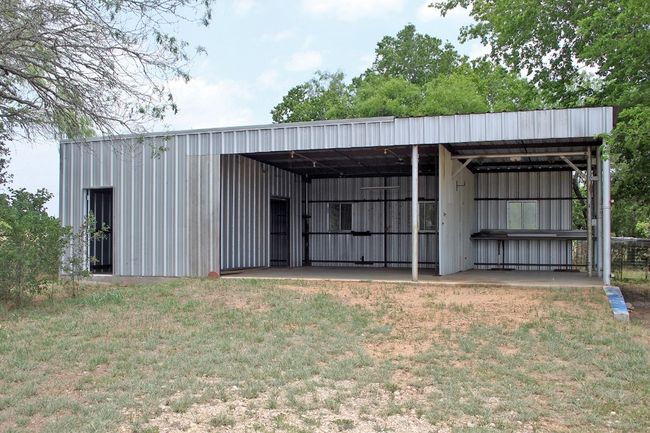 View of pole building featuring a yard | Image 6