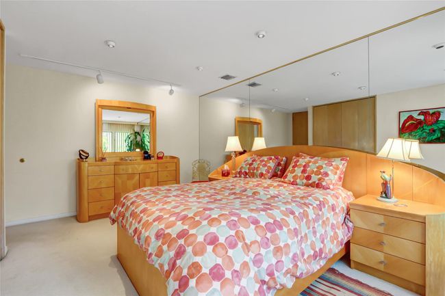 Bedroom with track lighting, visible vents, and light carpet | Image 20