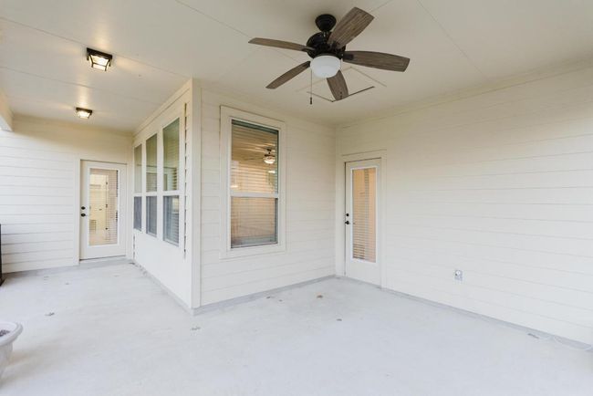 Covered back patio with ceiling fan | Image 38