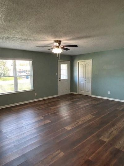 Front door entry and massive living space. | Image 3