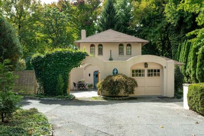 Known as one of the first homes built in Tokeneke, this stucco and stone house has been meticulously maintained and updated by the same owners for nearly 30 years. | Image 1