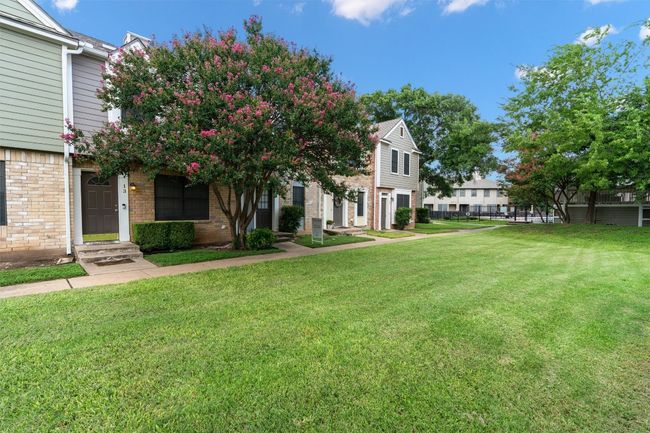 View of grassy yard featuring a residential view | Image 8