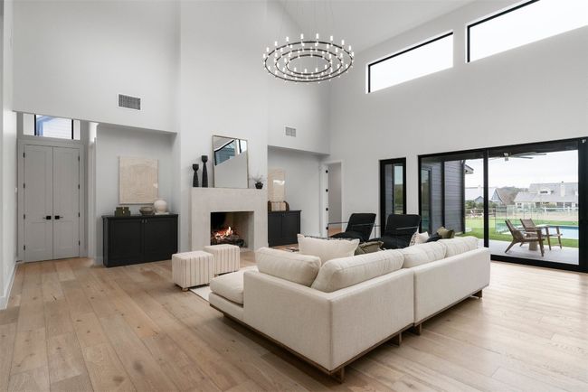 Vaulted ceilings with exposed wood beams amplify the sense of space | Image 7
