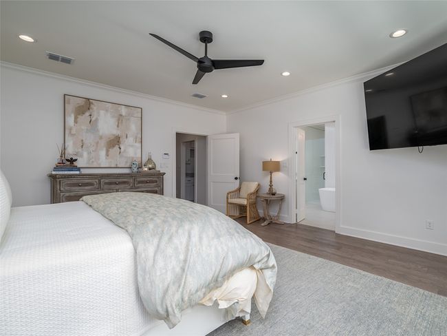 Bedroom featuring ornamental molding, wood finished floors, recessed lighting, a ceiling fan, and connected bathroom | Image 17
