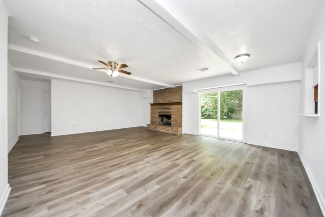 Huge living room, with option for formal dining to the right. Sliding door recently replaced. | Image 9