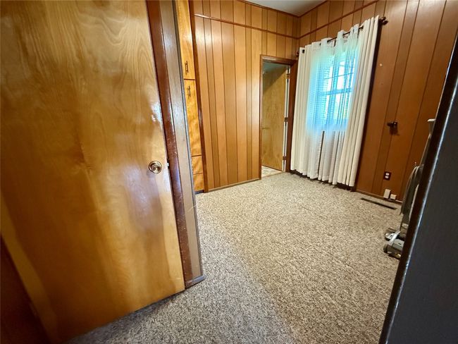 Office/extra room off of kitchen. Door to the left leads to the basement | Image 24