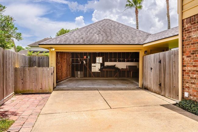 Two car garage and note the custom built area for your garbage bins so they are out of sight! | Image 35