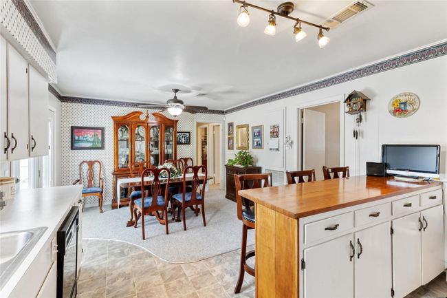 Spanning (21x13) the bright kitchen & dining combo opens smoothly into the main living areas, creating a spacious and comfortable layout ideal for everyday living. | Image 9