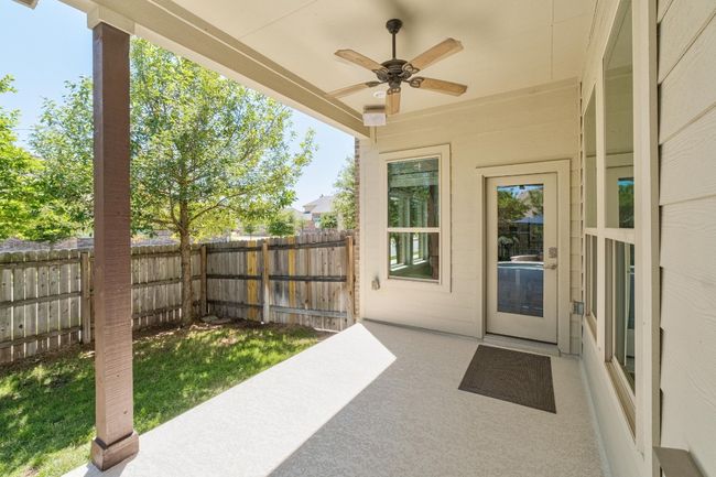 View of patio / terrace with a fenced backyard and ceiling fan | Image 35