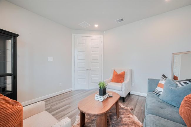 This inviting living room provides ample natural light and privacy. | Image 9