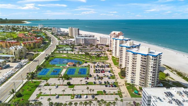 View of urban area with a large body of water and apartment complex | Image 20