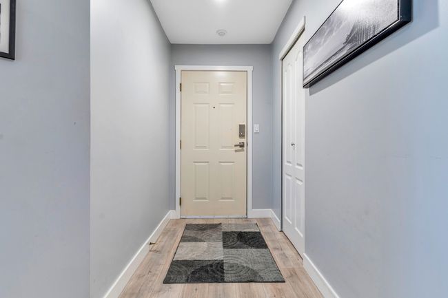 Doorway with baseboards and light wood finished floors | Image 25