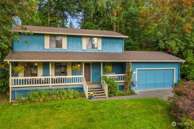 Solid move-in ready home in Beachcrest. The full length deck has plenty of room for you to relax and enjoy the views. | Image 1