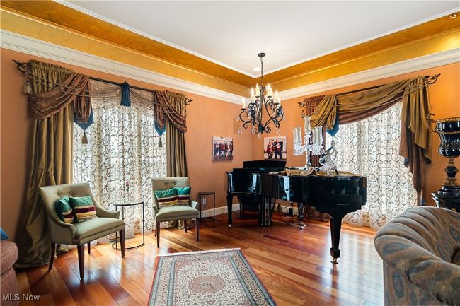 This is just a partial view of the large great room with hard wood flooring. Spectacular lighting. | Image 17