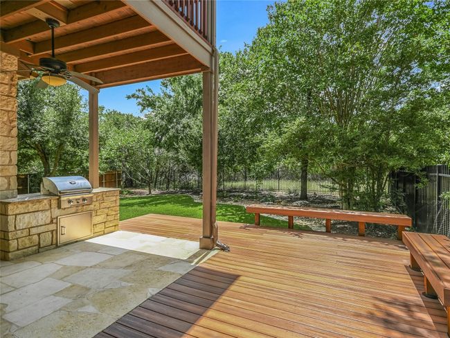 A built-in grill and beautiful custom deck with benches greatly expands your entertainment space. | Image 27